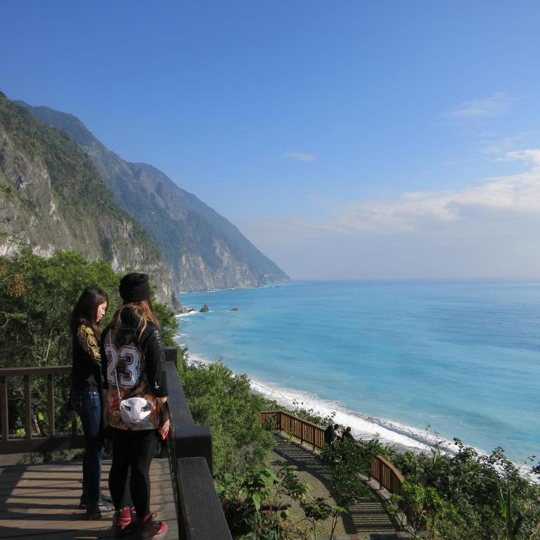 two women standing on a staircase looking at the beach at Taroko Susi Space in Xincheng