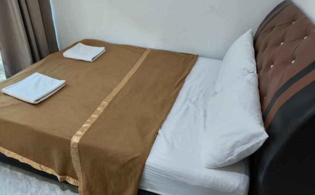 Postel nebo postele na pokoji v ubytování NaVita Lodge