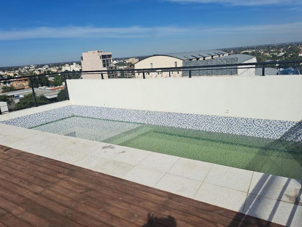 a swimming pool on the roof of a building at DEPARTAMENTO JARDIN in Santiago del Estero