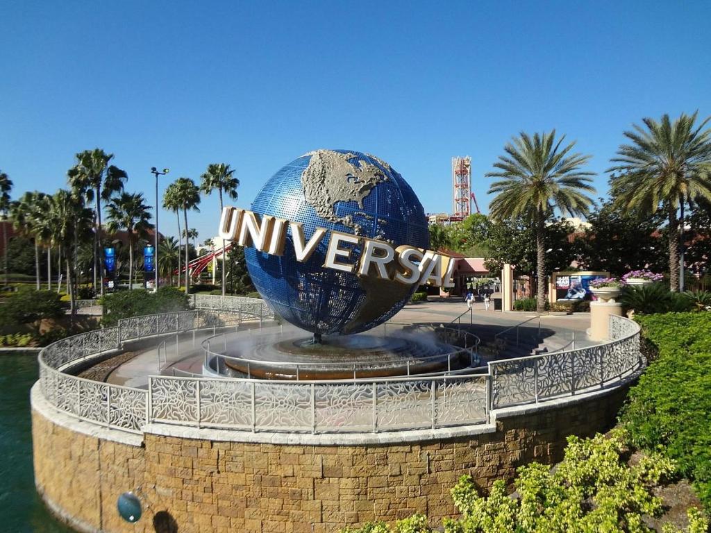 a large globe in a fountain in a park at Luxury 3bd, 2bath, universal studios in Orlando