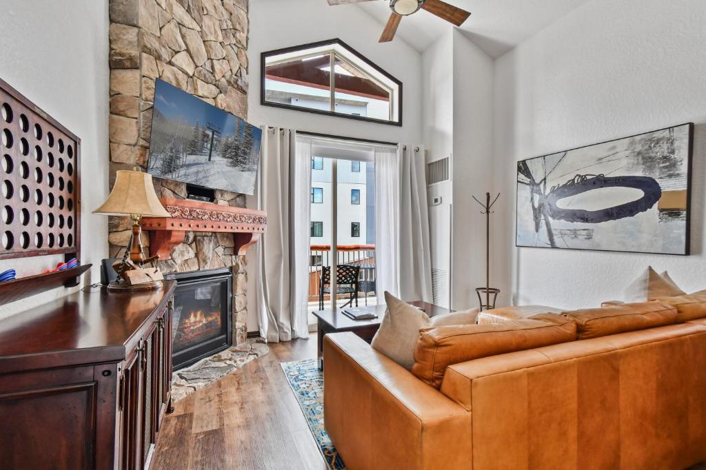 a living room with a couch and a fireplace at Westgate 2BR, private balcony, multiple pools, resort amenities, tennis, onsite spa, restaurant 3912 in Park City