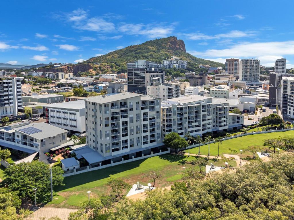 an aerial view of a city with buildings at City Stadium Apartment on the Riverfront 38 in Townsville