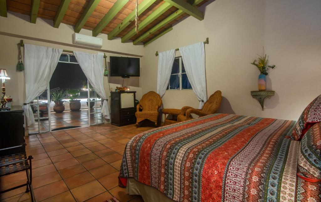 Postel nebo postele na pokoji v ubytování Casa Romance Escondido