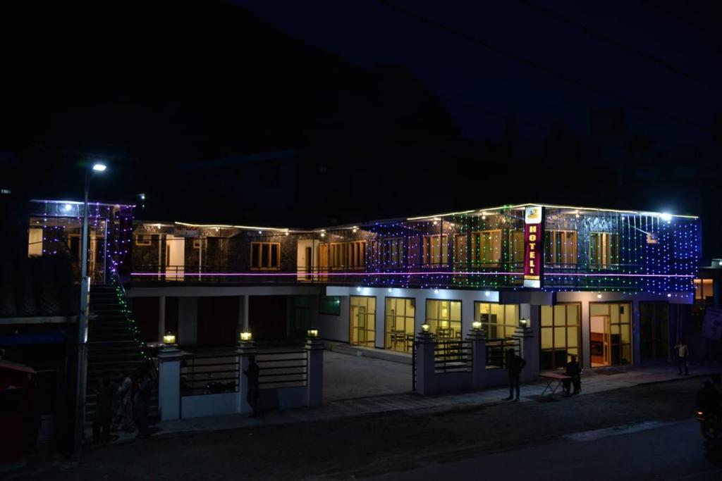 a building with christmas lights on it at night at Tufail palace in Skardu