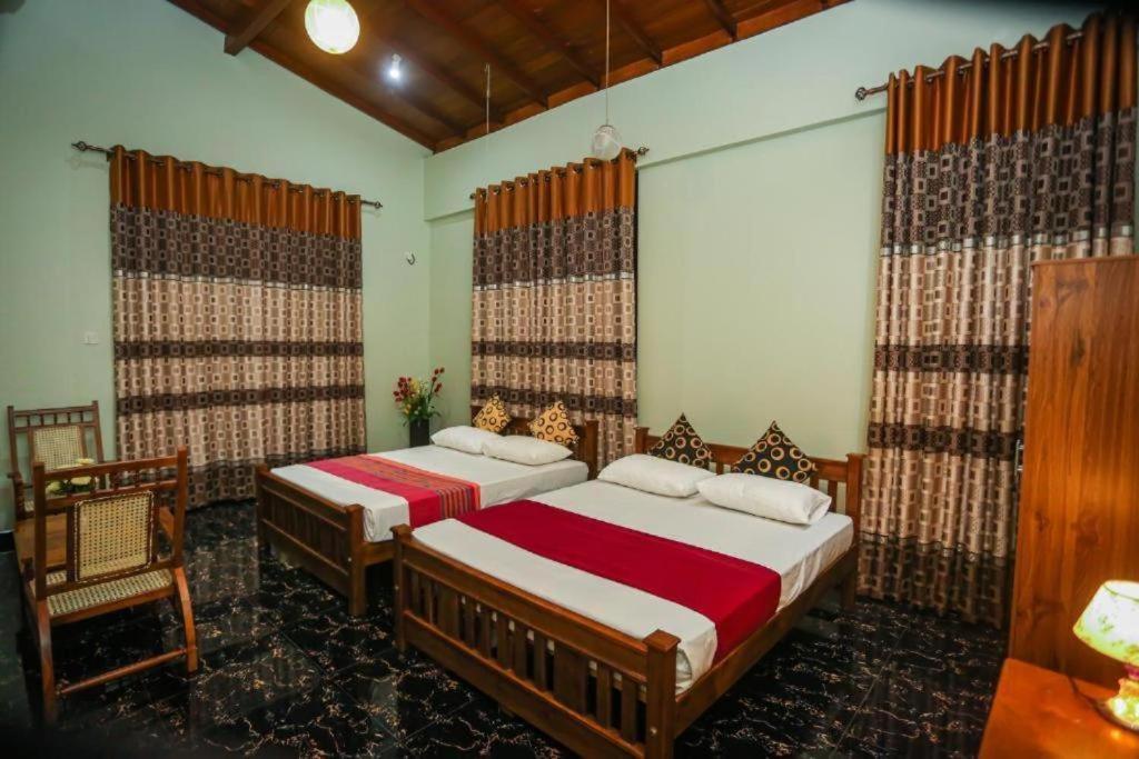 Ένα ή περισσότερα κρεβάτια σε δωμάτιο στο Apartments by Nirosha Guest House