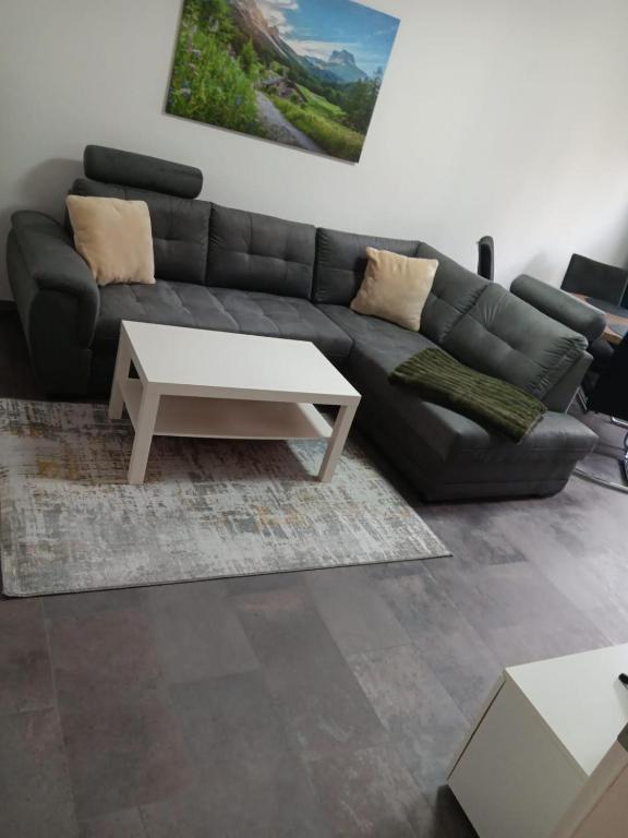 a living room with a couch and a table at Serenity in Bad Harzburg