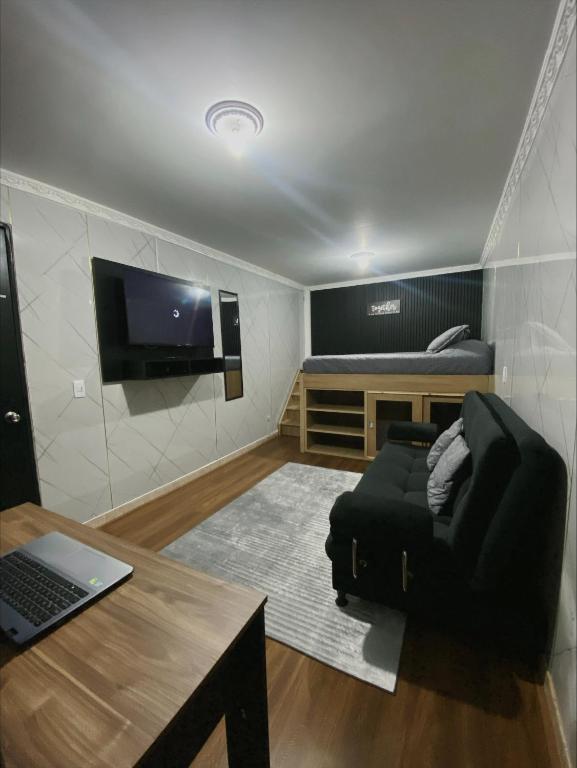 TV a/nebo společenská místnost v ubytování Hotel Canela 96