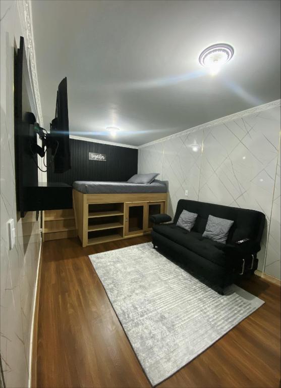 TV a/nebo společenská místnost v ubytování Hotel Canela 96