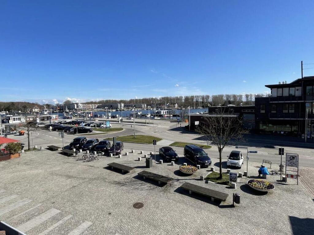 a parking lot with cars parked in a parking lot at On the Trave Comfortable holiday residence in Travemünde