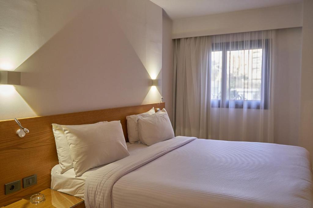 Postel nebo postele na pokoji v ubytování New President Hotel Cairo