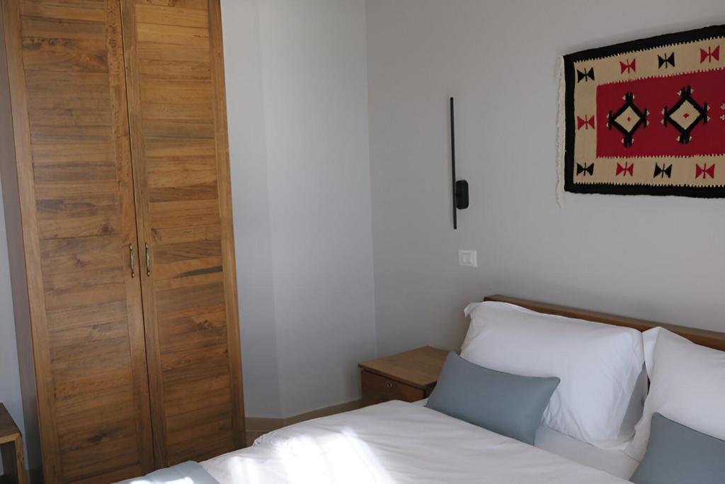Postel nebo postele na pokoji v ubytování Doko Hotel