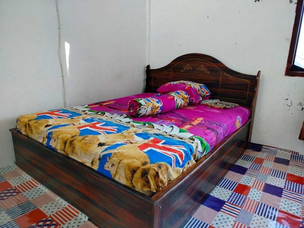Postel nebo postele na pokoji v ubytování Atta Ratu Homestay komodo