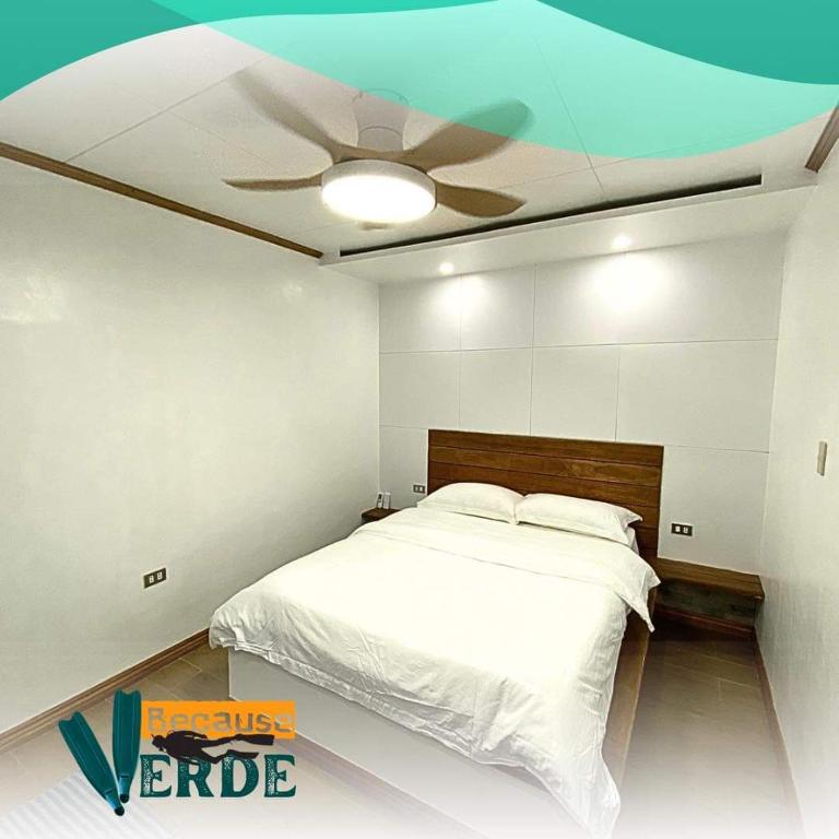 Säng eller sängar i ett rum på Because Verde Resort