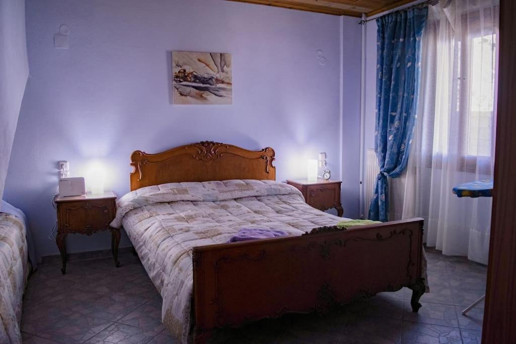 Postel nebo postele na pokoji v ubytování Υλονόμη