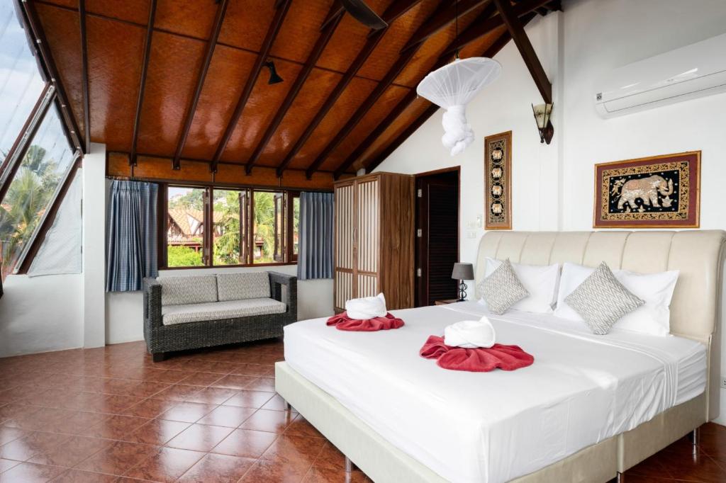 Postel nebo postele na pokoji v ubytování Beachfront Villa, Bang Po
