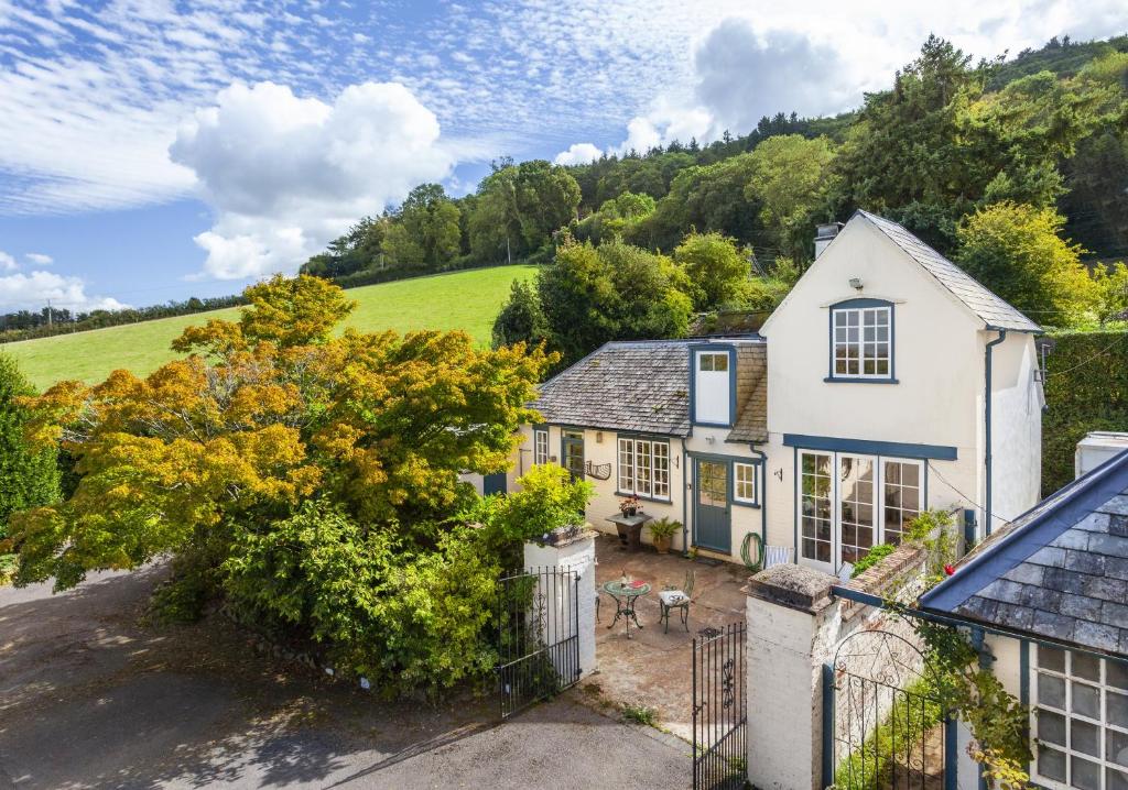 an aerial view of a house with a driveway at Coachman's Cottage, West Porlock in Porlock