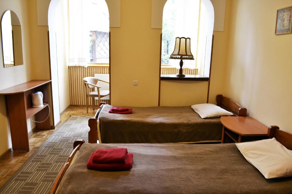 Postel nebo postele na pokoji v ubytování Malvy hotel
