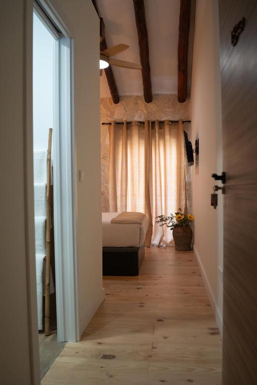 Postel nebo postele na pokoji v ubytování Hotel Boutique - Estancia dos Olivos