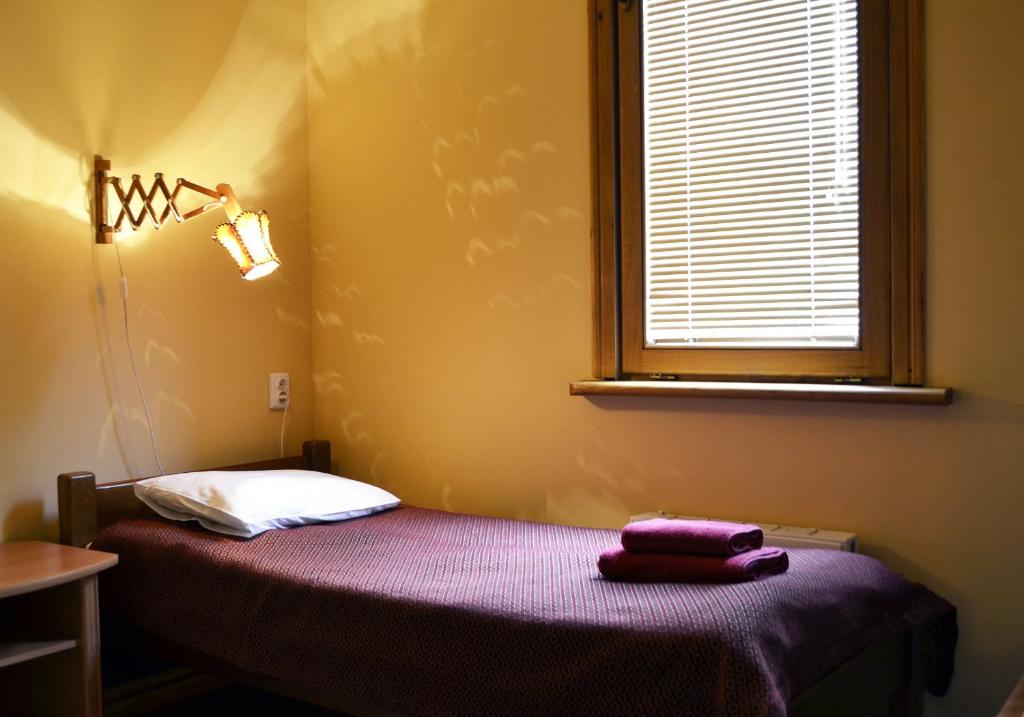 Postel nebo postele na pokoji v ubytování Malvy hotel