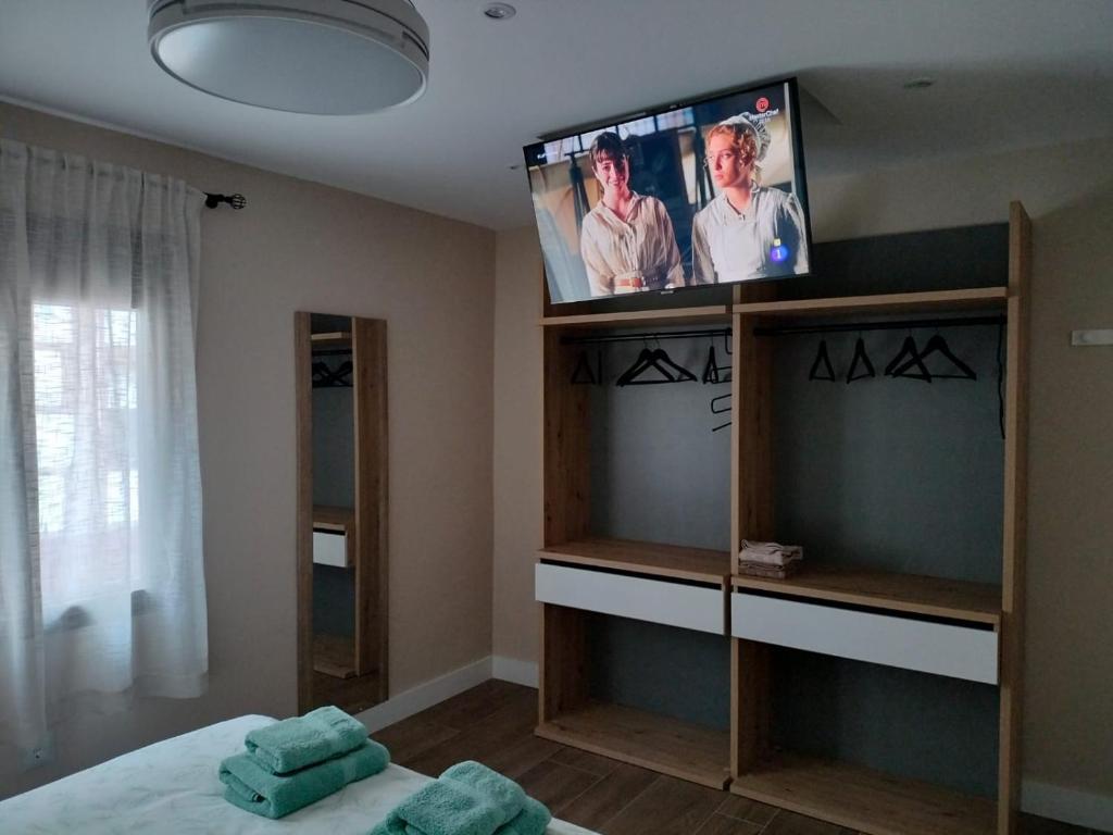 TV a/nebo společenská místnost v ubytování Arco de Toledo