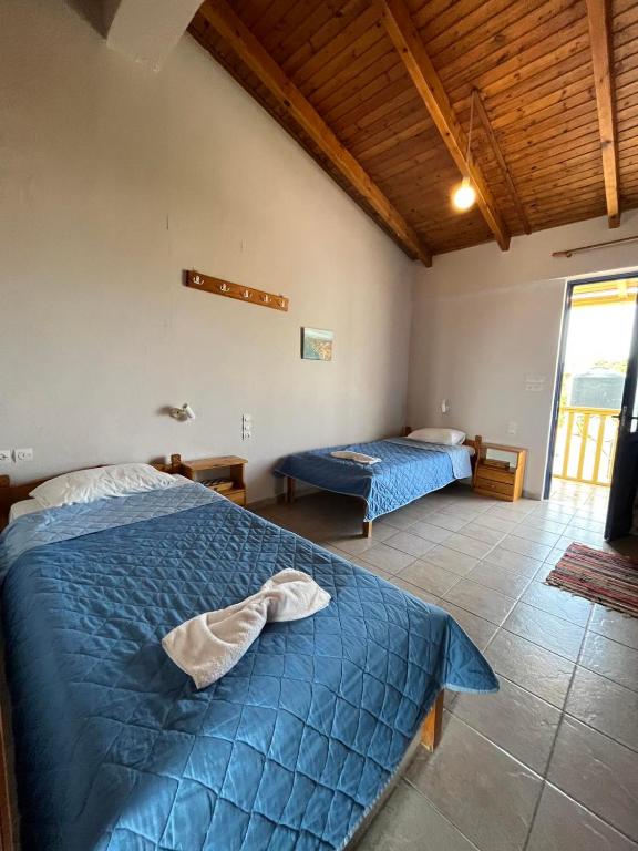 Postel nebo postele na pokoji v ubytování Ilios Kalamaki
