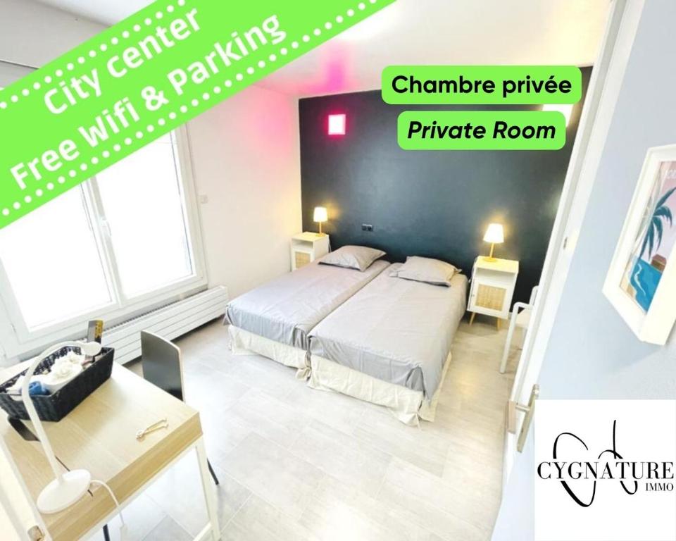 a bedroom with a bed and a table and a desk at Flatshare Colocation 4 close to Geneva in Saint-Genis-Pouilly