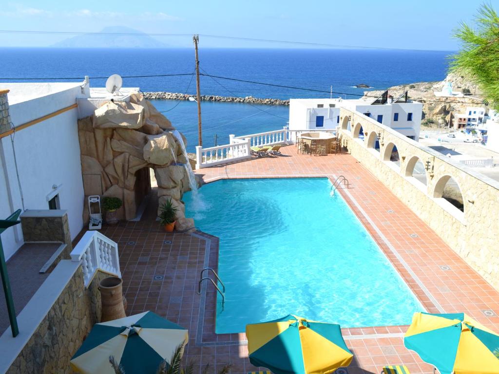 a swimming pool with a view of the ocean at Hotel Finiki View in Foiníkion