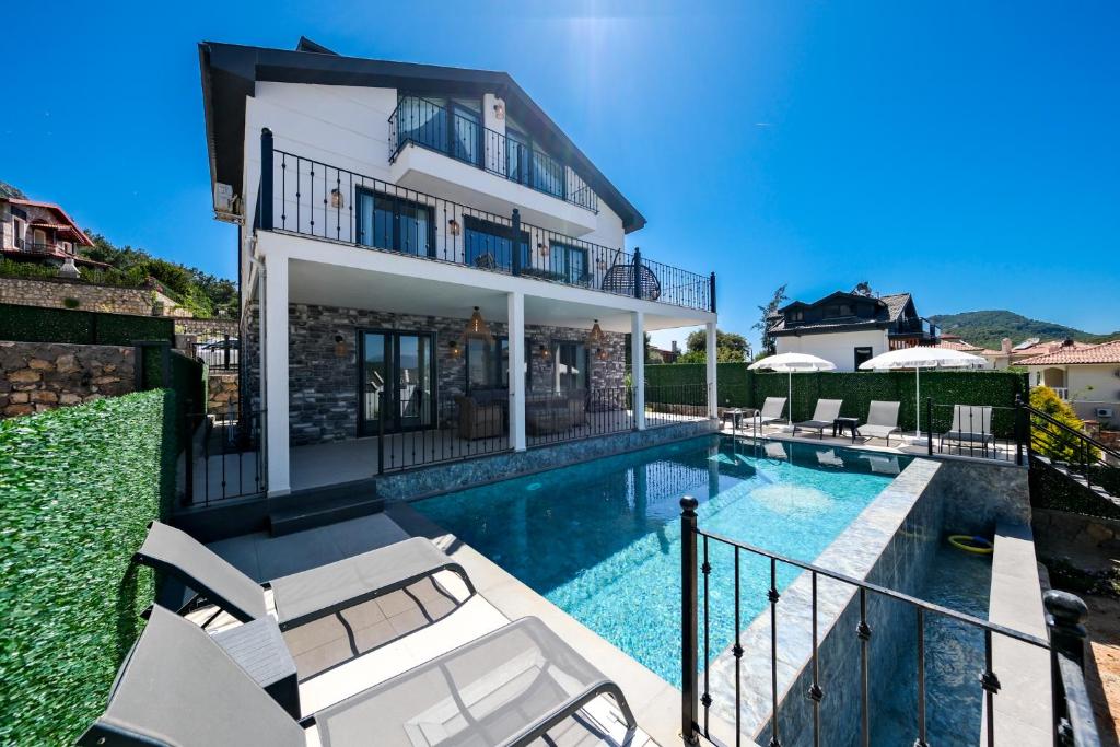 Swimming pool sa o malapit sa Oasis Family-Friendly Luxury Villa Fethiye Oludeniz by Sunworld Villas