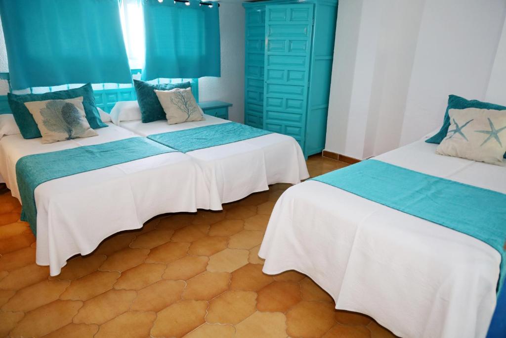 Postel nebo postele na pokoji v ubytování Hotel Marazul