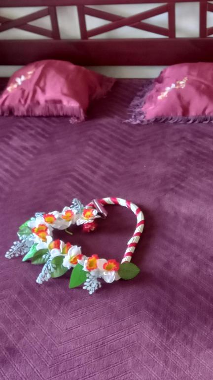 a toy snake is laying on a bed at Ventspils Juras in Ventspils
