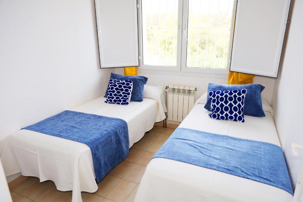 Postel nebo postele na pokoji v ubytování Hotel Marazul