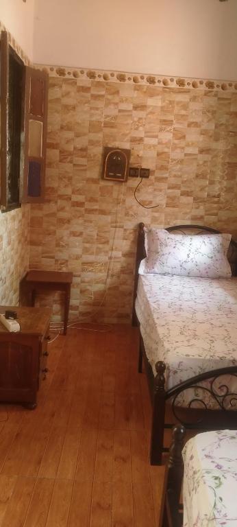 Postel nebo postele na pokoji v ubytování L'Oa