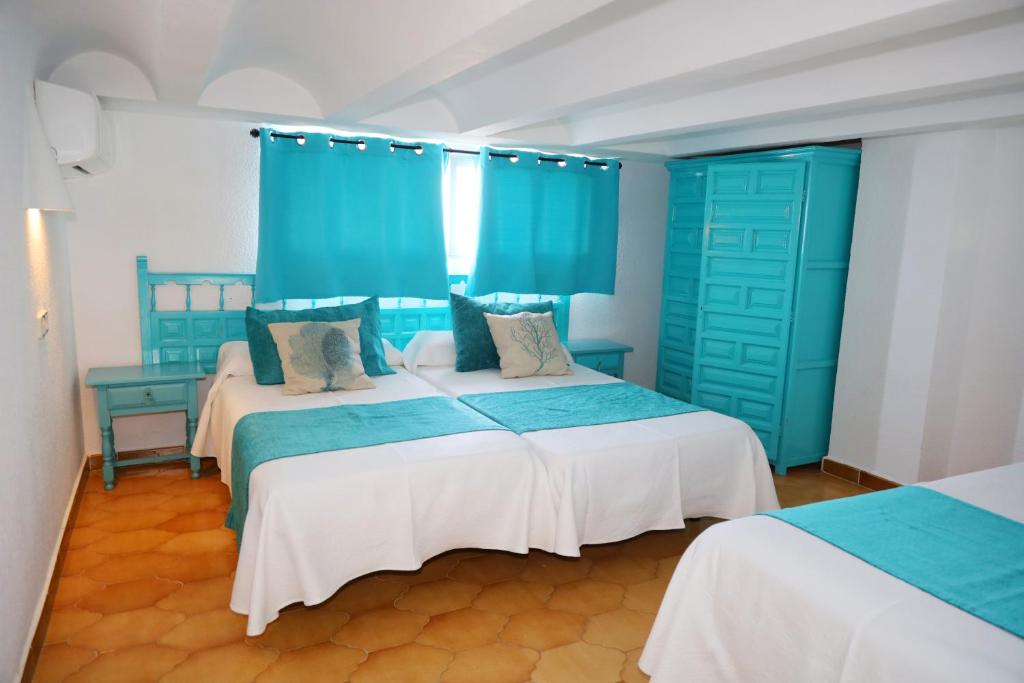 Postel nebo postele na pokoji v ubytování Hotel Marazul