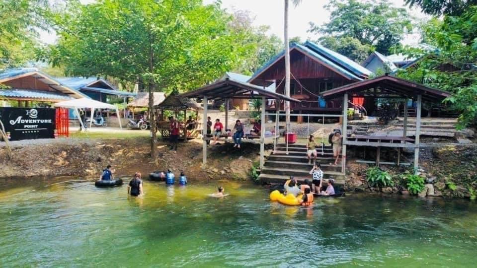 a group of people in the water in a river at Adventure Point Resort By Sali in Kaeng Krachan