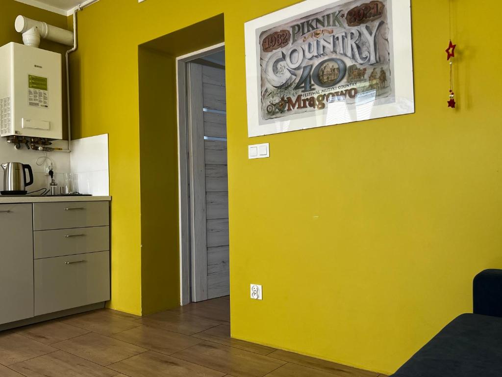 Kuchyňa alebo kuchynka v ubytovaní Apartament MRĄGOWIA