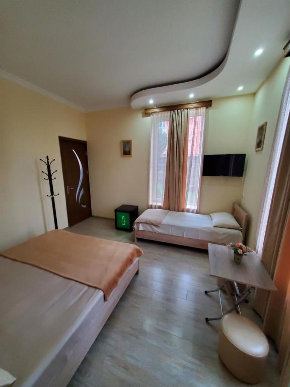 Postel nebo postele na pokoji v ubytování MAKA Hotel