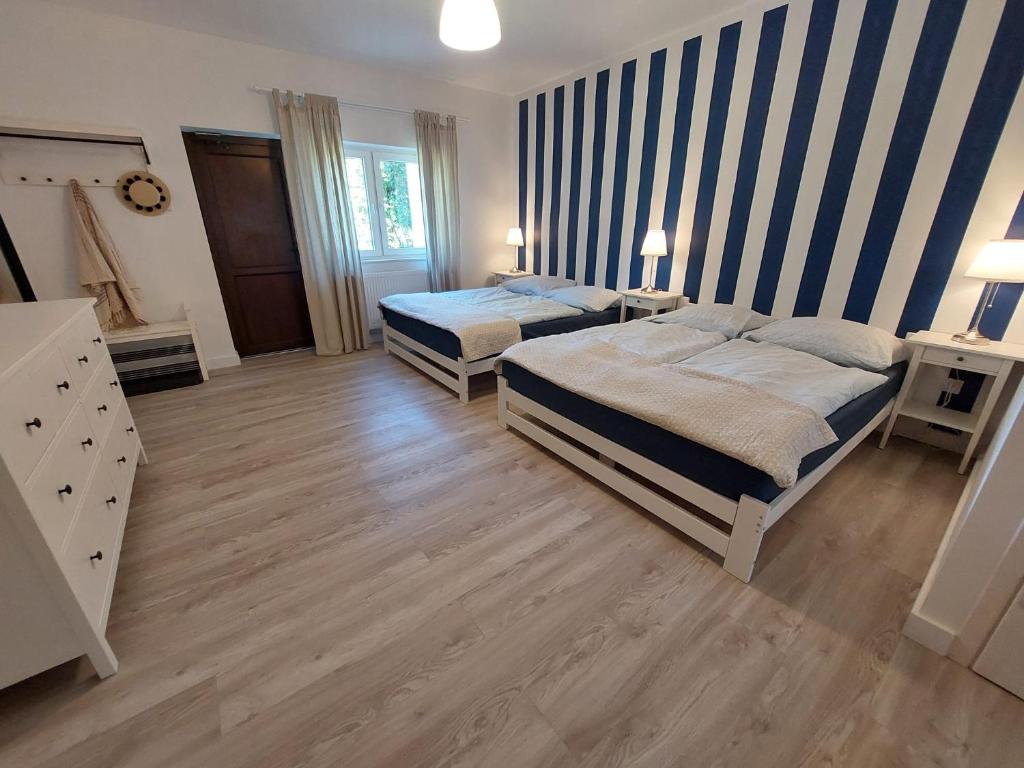 Postel nebo postele na pokoji v ubytování Bajkowy Las
