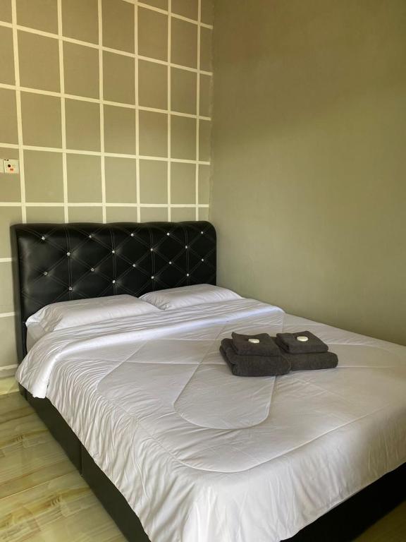 Postel nebo postele na pokoji v ubytování Julies Hostel Taman Negara