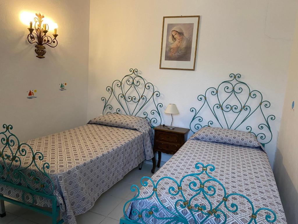 Postel nebo postele na pokoji v ubytování Résidence Playa Del'Oro