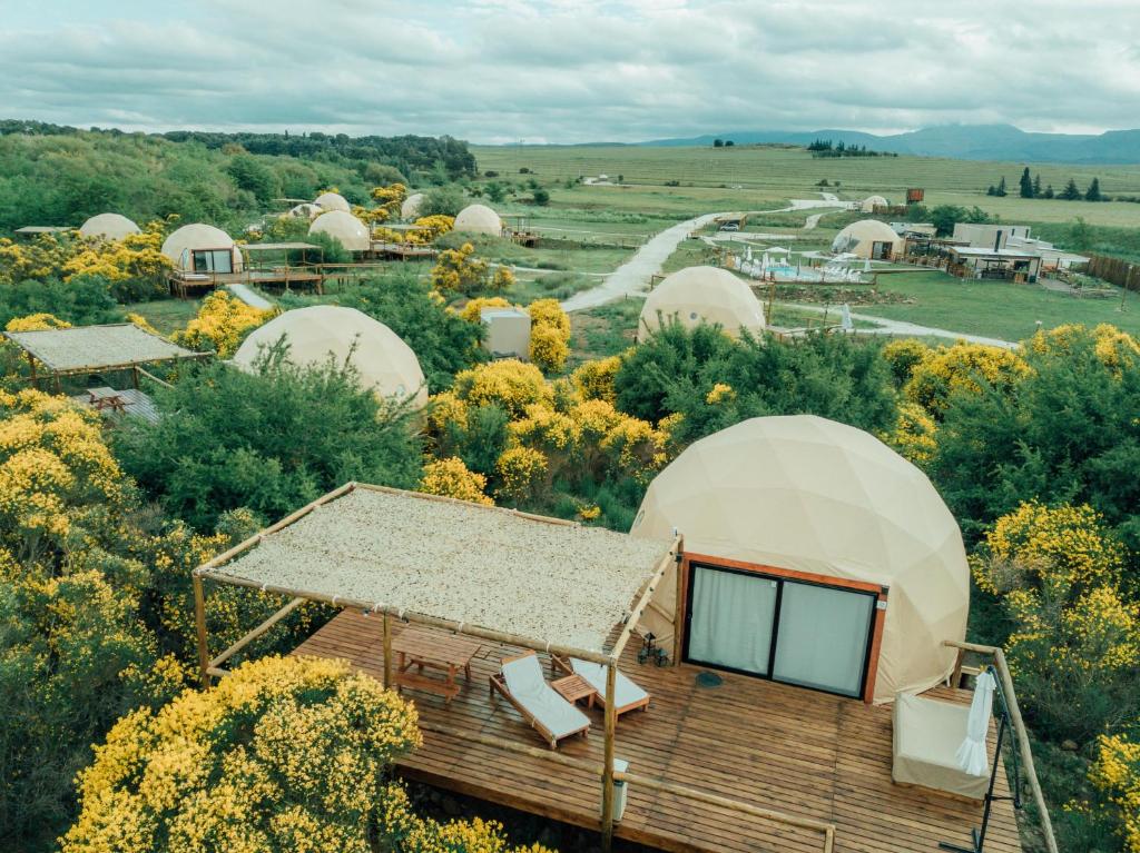 an overhead view of a dome facility with a building at Glamping Puente Blanco in Sierra de la Ventana