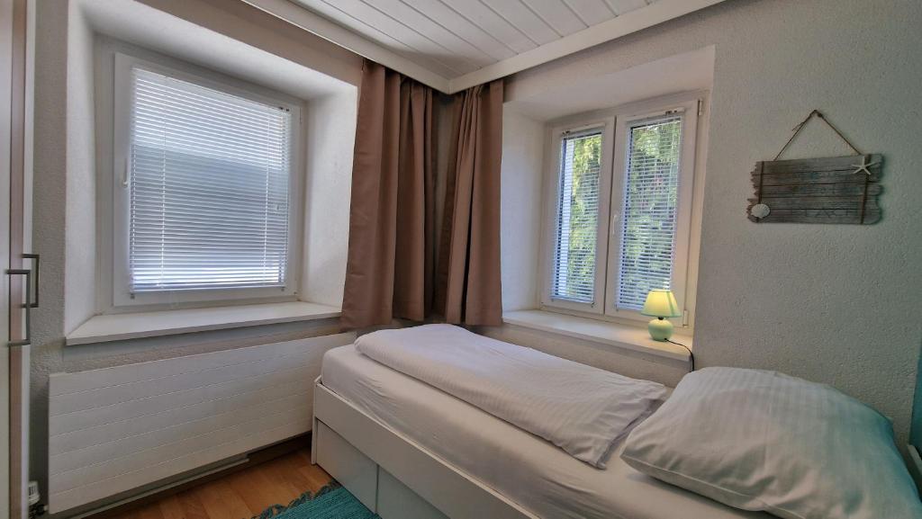 Postel nebo postele na pokoji v ubytování homy Bludenz Downtown Suites