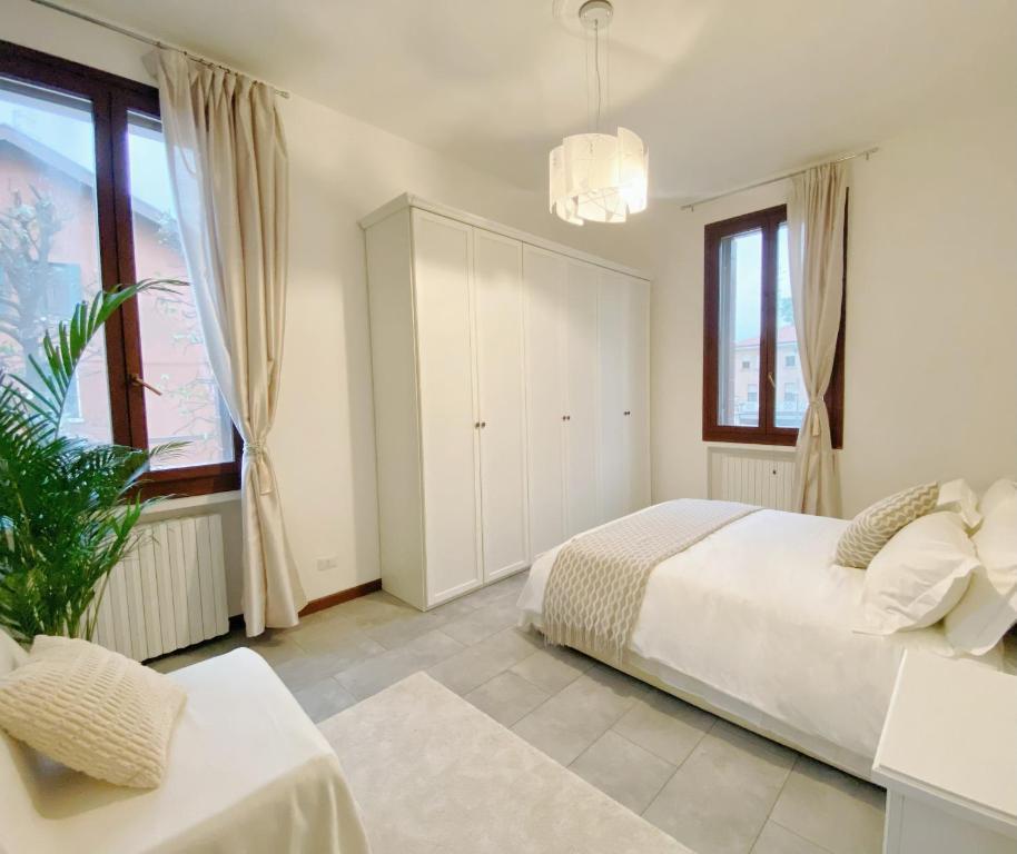 Ένα ή περισσότερα κρεβάτια σε δωμάτιο στο Gris Apartment: Venice Mestre