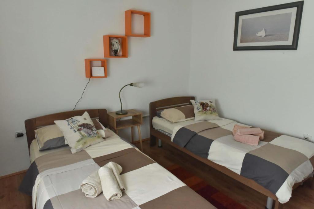Postel nebo postele na pokoji v ubytování Apartmani Reset