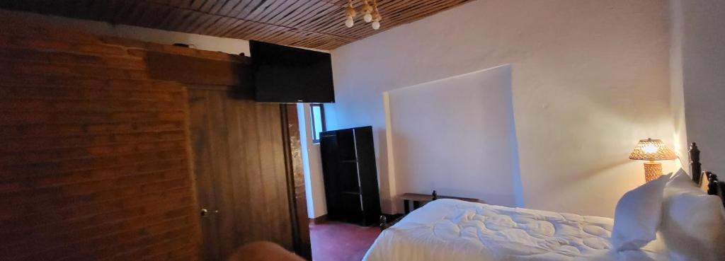 Postel nebo postele na pokoji v ubytování Alojamiento El Fresno