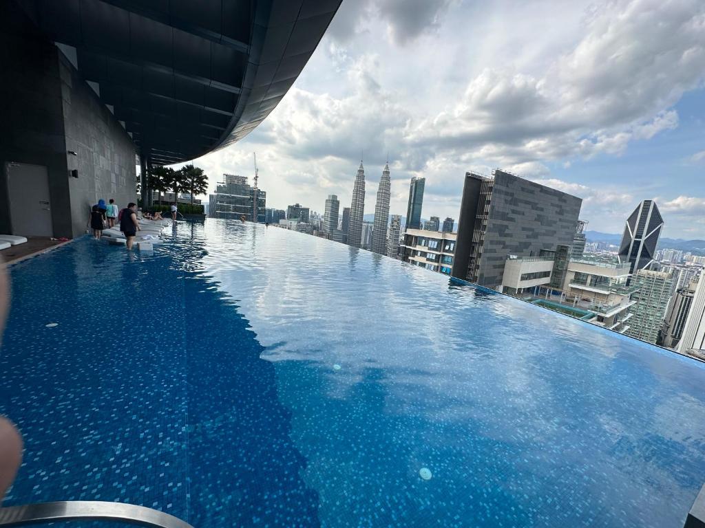 a swimming pool on the roof of a building at Eaton Residences KLCC by Ikon in Kuala Lumpur