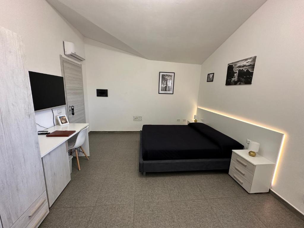 TV a/nebo společenská místnost v ubytování LXR Rooms Carloforte