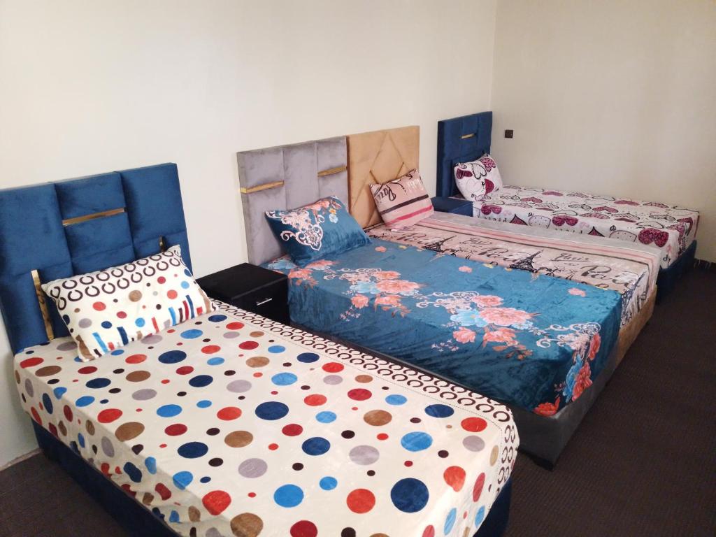 Ліжко або ліжка в номері Gite Dar Amgdoule