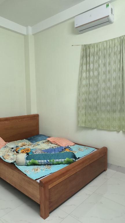 Säng eller sängar i ett rum på Quy Nhơn Apt