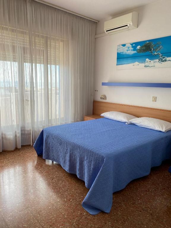 Postel nebo postele na pokoji v ubytování Hotel Ariston