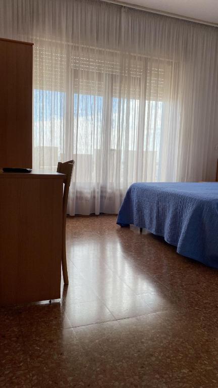Postel nebo postele na pokoji v ubytování Hotel Ariston